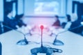 Conference microphones on the table over blurred of attendee in meeting room background Royalty Free Stock Photo