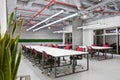 Conference room interior with empty chairs and a projector screen