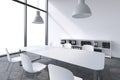 A conference room in a modern panoramic office with white copy space in windows. White table, white chairs, two white ceiling ligh Royalty Free Stock Photo