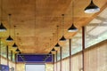 A conference room with wooden ceiling and chandelier