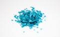 Confetti blue color heap isolated on white. Circle paper pile, carnival, celebration party