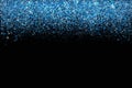 Confetti in shades of Classic Blue border isolated on black. Falling sparkles dots. Shiny dust vector background. The color of