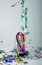 Confetti shooting from a party popper Royalty Free Stock Photo