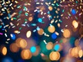 Confetti sparkles as it falls against a bokeh lights background. generative AI Royalty Free Stock Photo