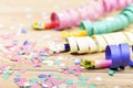 Confetti, streamers and party blower on wood background Royalty Free Stock Photo