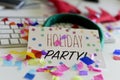 Confetti and text holiday party in an office