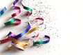 confetti and vibrant carnival ribbons on a white background Royalty Free Stock Photo