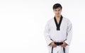 Confidence athlete strong young man wear uniform taekwondo holding black belt in own hand while standing over isolated white