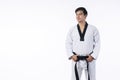 Confidence athlete strong young man wear uniform taekwondo holding black belt in own hand while standing over isolated white