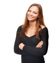 Confidence is a beautiful feature in a woman. Studio shot of a beautiful young woman standing with her arms folded. Royalty Free Stock Photo