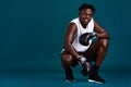 Confidence breeds my strength. Full length portrait of a handsome young boxer crouching against a dark background with Royalty Free Stock Photo