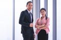 Confidence Business couple standing by windows Royalty Free Stock Photo