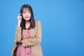 Confidence business positive Asian young woman thinking have good idea holding finger on head looking at copy space standing over Royalty Free Stock Photo