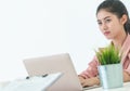 Confidence Business woman in pink portrait with laptop business office