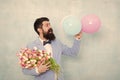 Confidence and charisma. Man bearded gentleman suit bow tie hold air balloons and bouquet. Gentleman making romantic