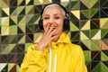 Confidence is the new beauty. Cropped portrait of an attractive young woman listening to music through headphones and Royalty Free Stock Photo