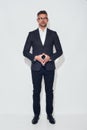 Confidence and success. Full length of handsome businessman in classic wear and eyeglasses looking at camera standing Royalty Free Stock Photo