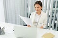 Confidence woman concept, Businesswoman drinking coffee and reading financial data on document Royalty Free Stock Photo