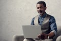 confident african american businessman with laptop sitting Royalty Free Stock Photo