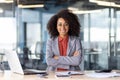 Confident african american businesswoman in office with arms crossed Royalty Free Stock Photo