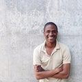 Confident african american man smiling with arms crossed Royalty Free Stock Photo