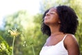 Confident African American woman outside in a garden. Royalty Free Stock Photo