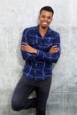 Confident african man leaning against wall with arms crossed Royalty Free Stock Photo