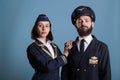 Confident airplane captain and stewardess couple