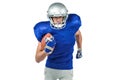 Confident American football player running with ball Royalty Free Stock Photo