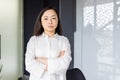 Confident asian businesswoman at office desk exuding leadership and professionalism Royalty Free Stock Photo