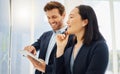 Confident asian businesswoman thinking of ideas with her hand on her chin while planning a project with a caucasian Royalty Free Stock Photo