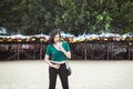 Confident Asian woman using mobile phone on the beach,Happy and smiling,Relax time,Summer travel concept Royalty Free Stock Photo