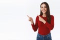Confident, assertive pretty modern brunette girl in red sweater promoting offer, advice link or recommend shop, product