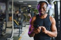 Confident athete with headphones in gym Royalty Free Stock Photo