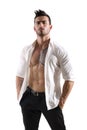 Confident, attractive young man with open shirt on muscular chest Royalty Free Stock Photo