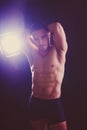 Confident, attractive shirtless muscular young man topless in studio Royalty Free Stock Photo