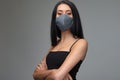 Confident attractive woman wearing a face mask