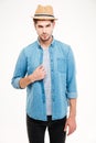 Confident attractive young man in blue shirt and hat Royalty Free Stock Photo