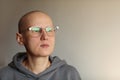 Confident bald woman in glasses struggle with oncology. Hairless cancer sick female patient after chemotherapy lost her Royalty Free Stock Photo