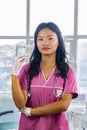 Confident Beautiful Indian Looking Nepali Dentist Doctor Girl Smiling and Giving gestures