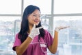 Confident Beautiful Indian Looking Nepali Dentist Doctor Girl Smiling and Giving gestures