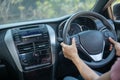 Confident and beautiful. Rear view of attractive young woman in casual wear looking over her shoulder while driving a car. girl Royalty Free Stock Photo