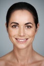 Confident beauty. Cropped studio portrait of a beautiful mature woman smiling. Royalty Free Stock Photo