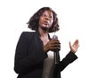 Confident black African American business woman with microphone speaking in auditorium at corporate event or seminar giving Royalty Free Stock Photo