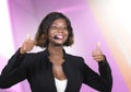 Confident black afro American business woman with microphone speaking in auditorium at corporate seminar event giving success