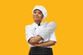 Confident black female chef with crossed arms wearing an oven mitt Royalty Free Stock Photo