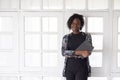 Black woman pose with tablet against office background Royalty Free Stock Photo