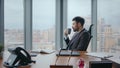 Confident boss taking coffee break sitting luxury office looking window close up Royalty Free Stock Photo