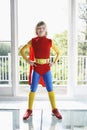 Confident Boy In Superhero Costume Indoors