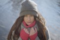 Confident brunette Caucasian woman looking at camera at the background of water outdoors. Portrait of serious grey-eyed Royalty Free Stock Photo